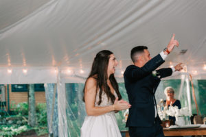 couple entering tent at new hampshire lakeside wedding