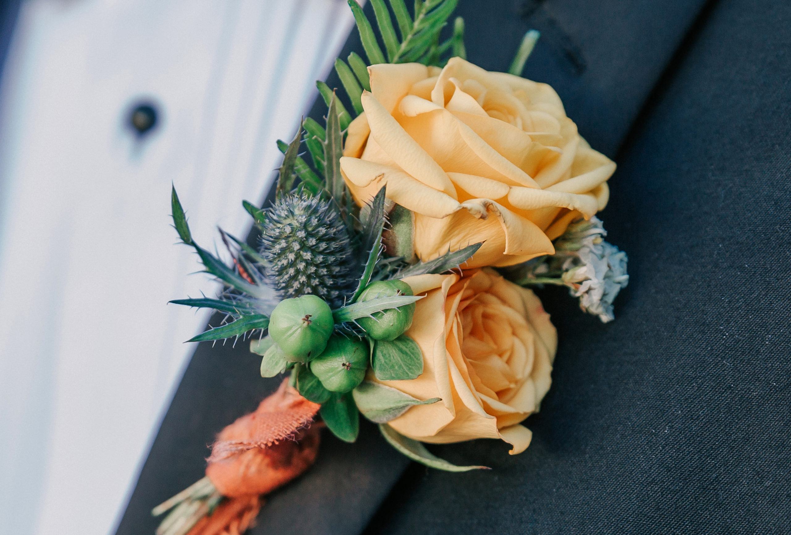 colorful boutonniere on a groom getting married at Valley View Farm in Haydenville, MA