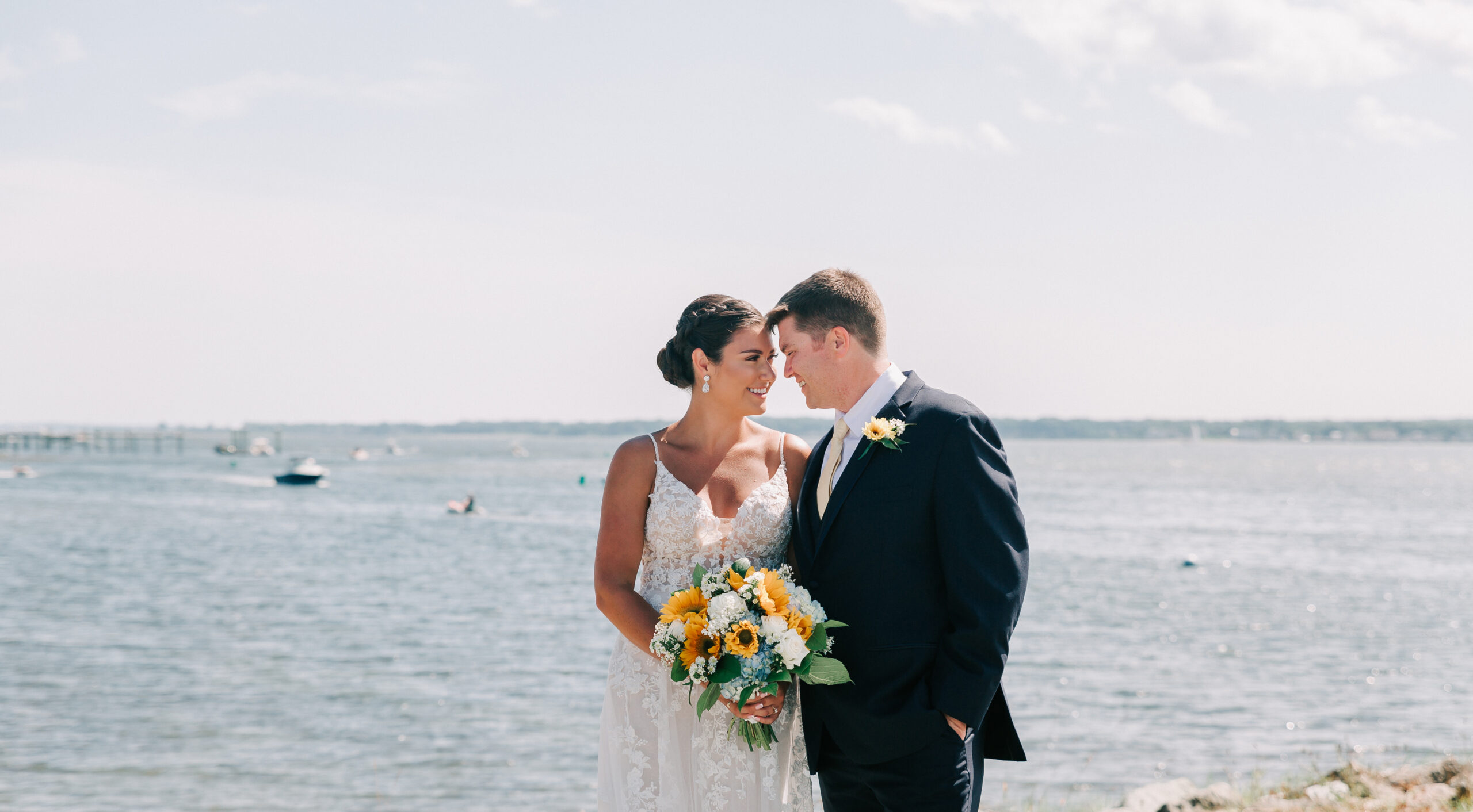 couple sharing their first look on the water at Harbor Lights, a Rhode Island wedding venue