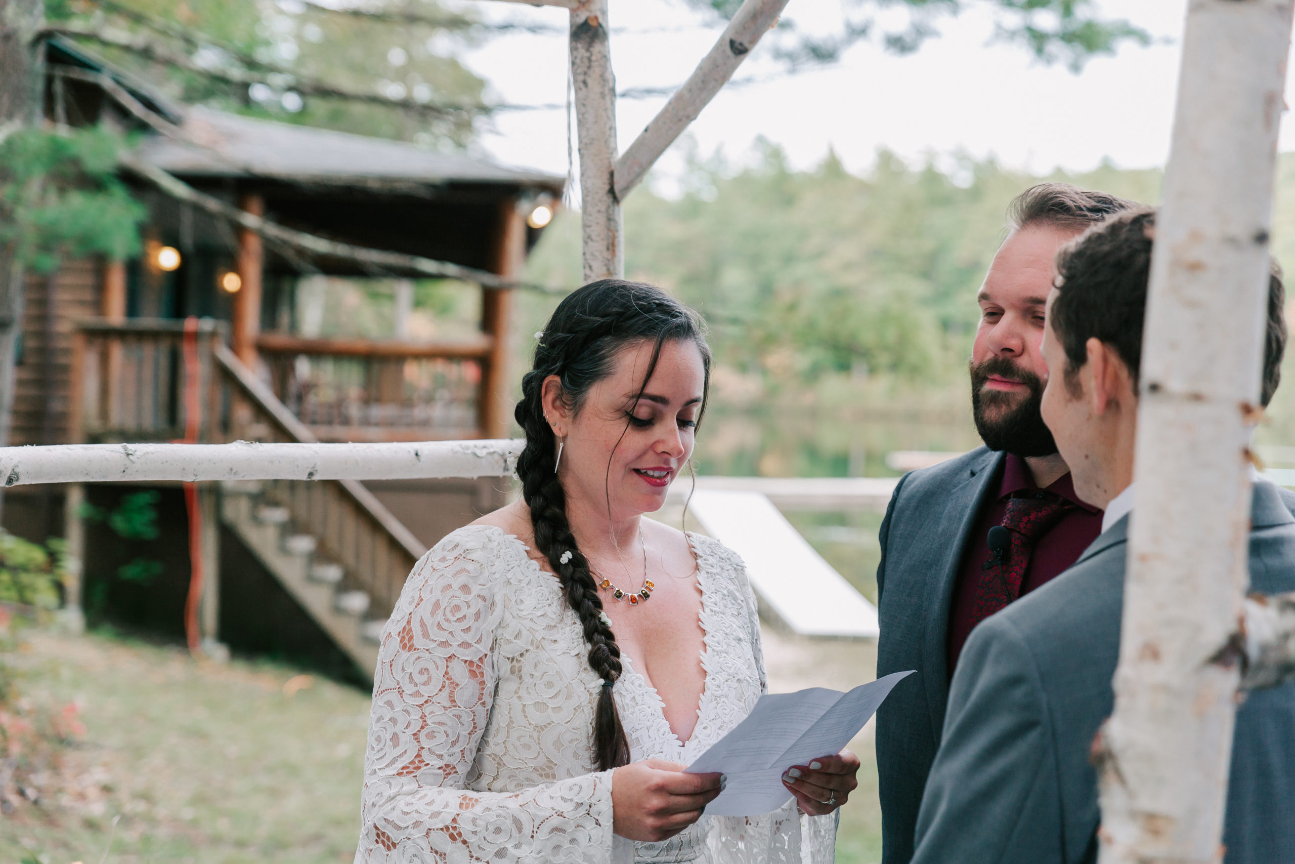 couple getting married by the lake at Camp Takodah, an alternative Southern NH wedding venue