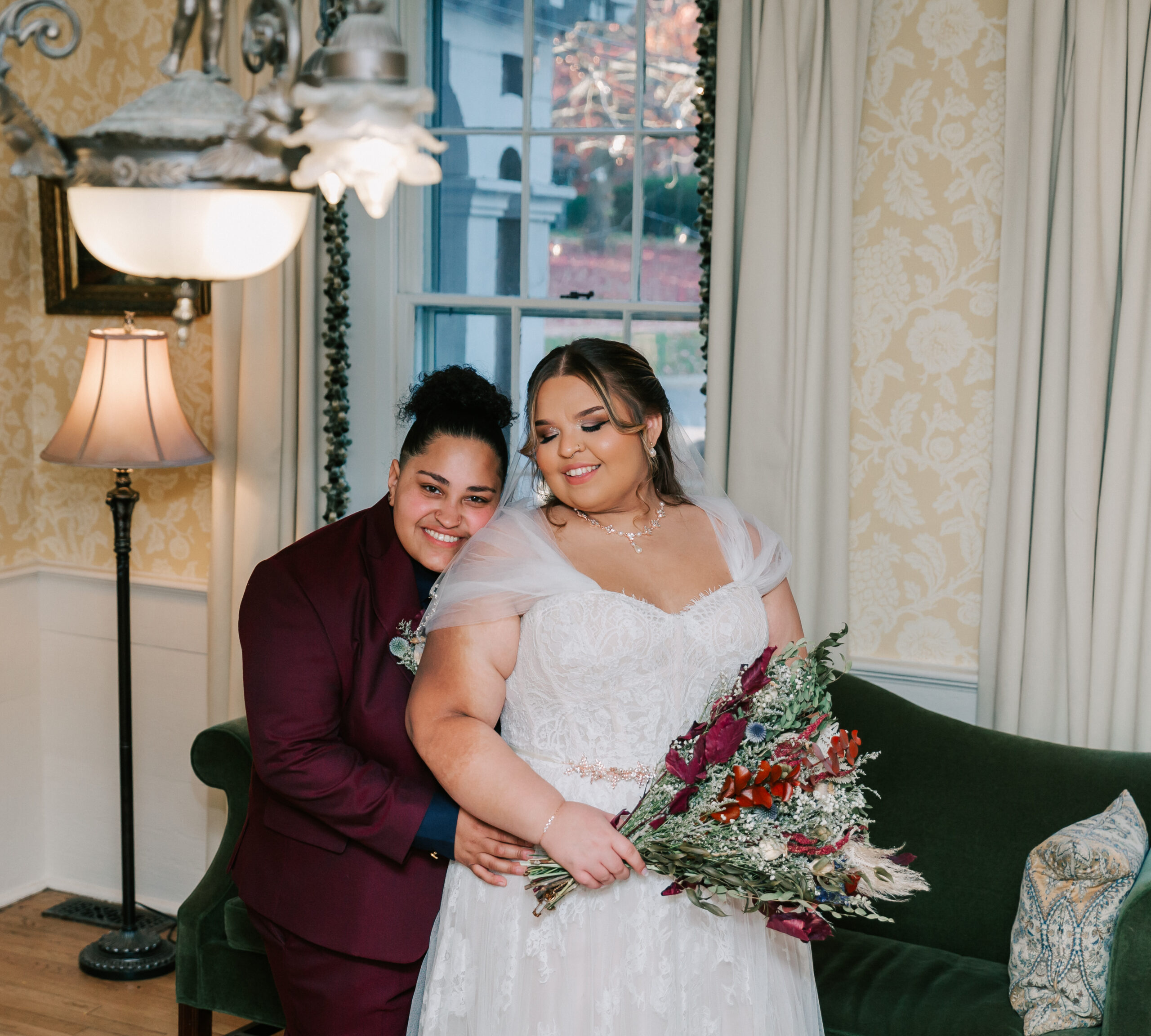 two brides celebrating their wedding at Concord's Colonial Inn, a beautiful historic wedding venue in Massachusetts