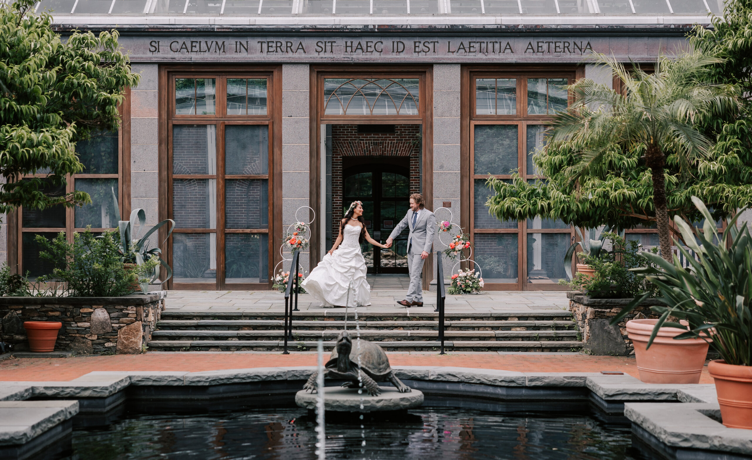 newly married couple dancing in the Winter Garden at Tower Hill Botanic Garden