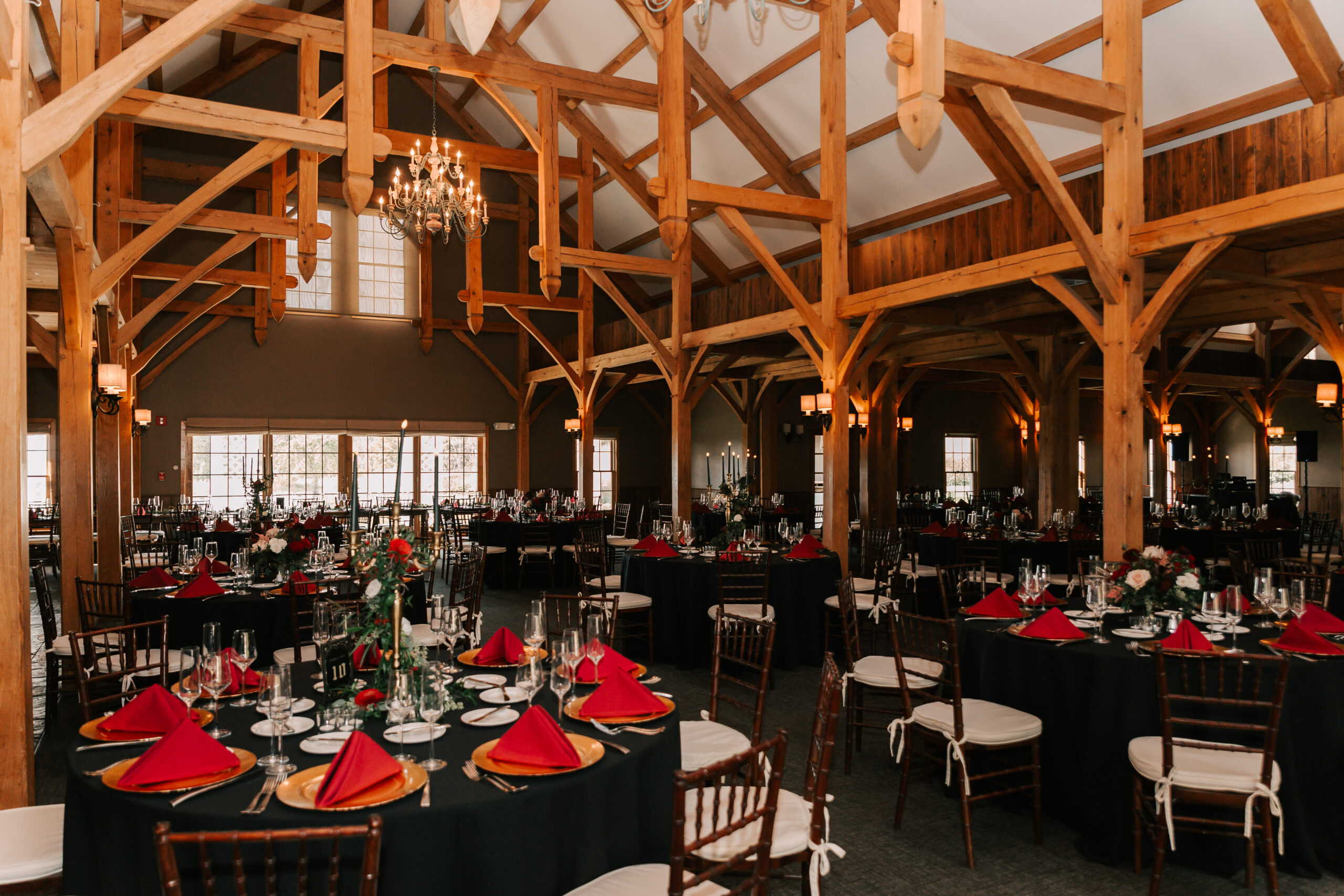 interior of the Barn at Harrington Farm, decorated for a moody autumn wedding