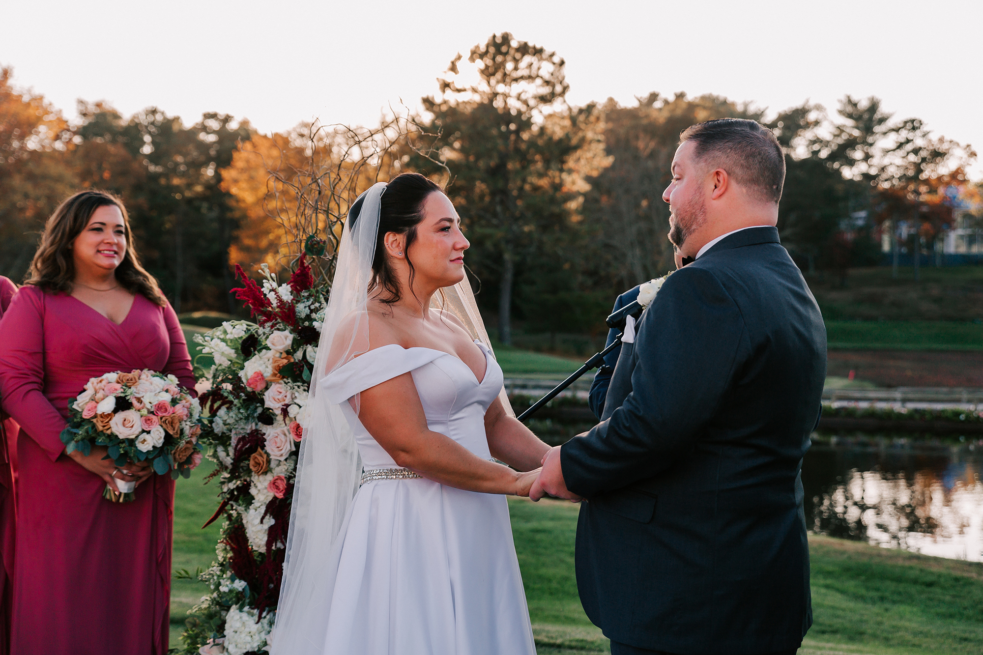 bride and groom holding hands about to get married at Willowbend Country Club in Mashpee, MA