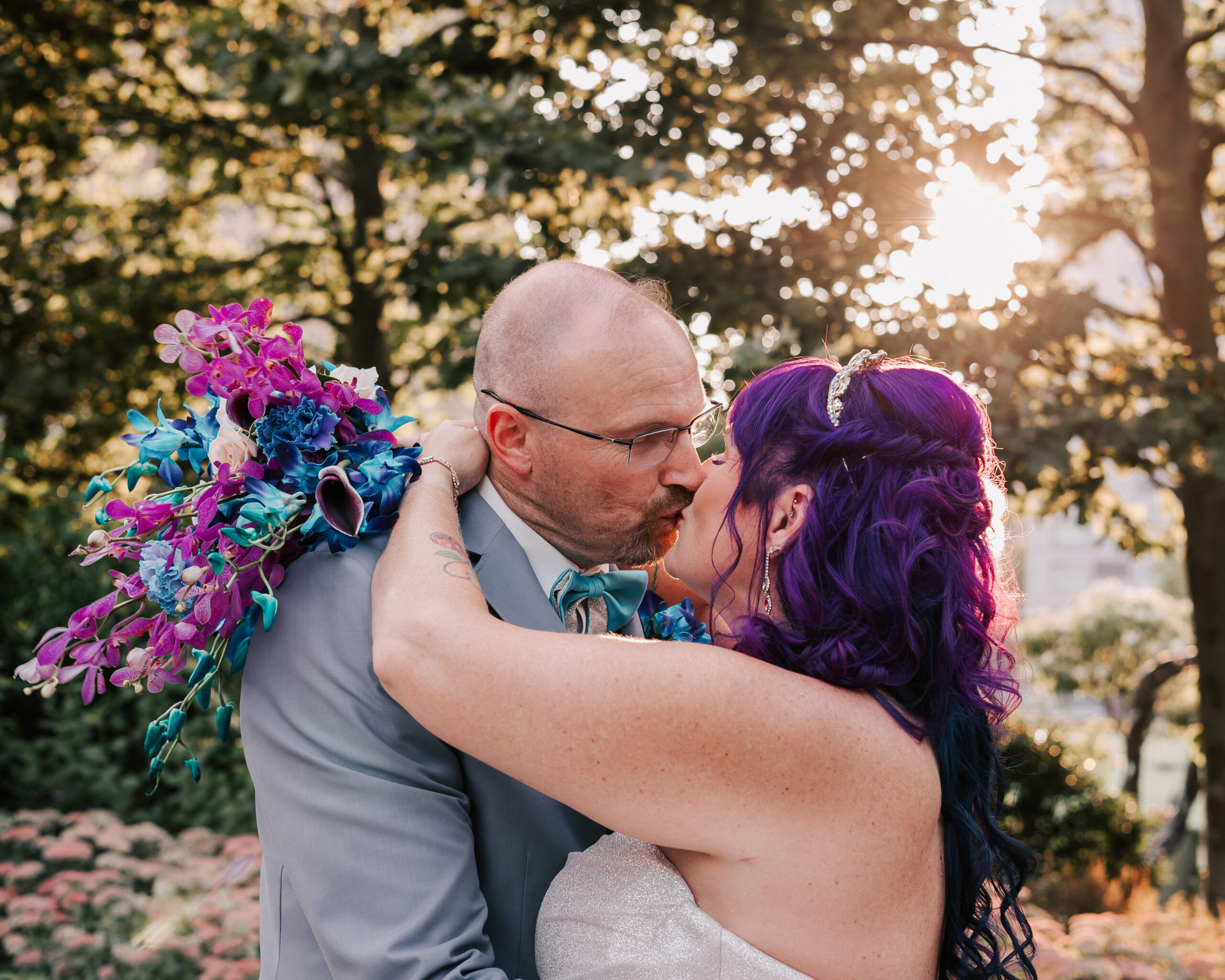 alternative couple kissing at wedding at Glass House in Cambridge, MA