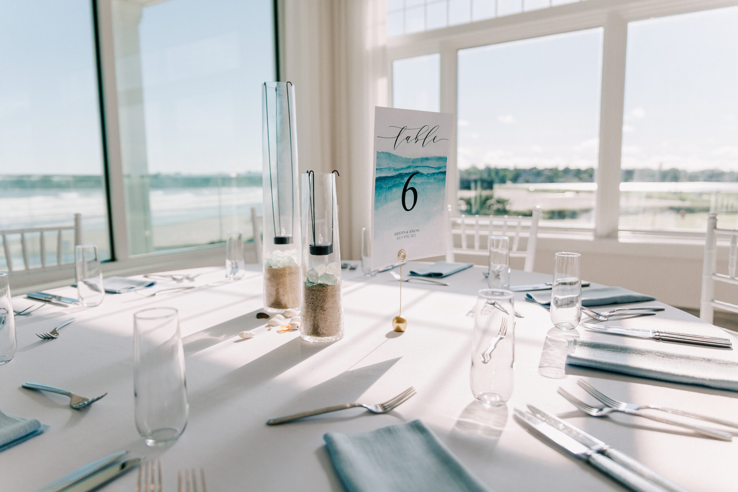 Table setting in wedding reception space at Newport Beach House, one of the Longwood venues