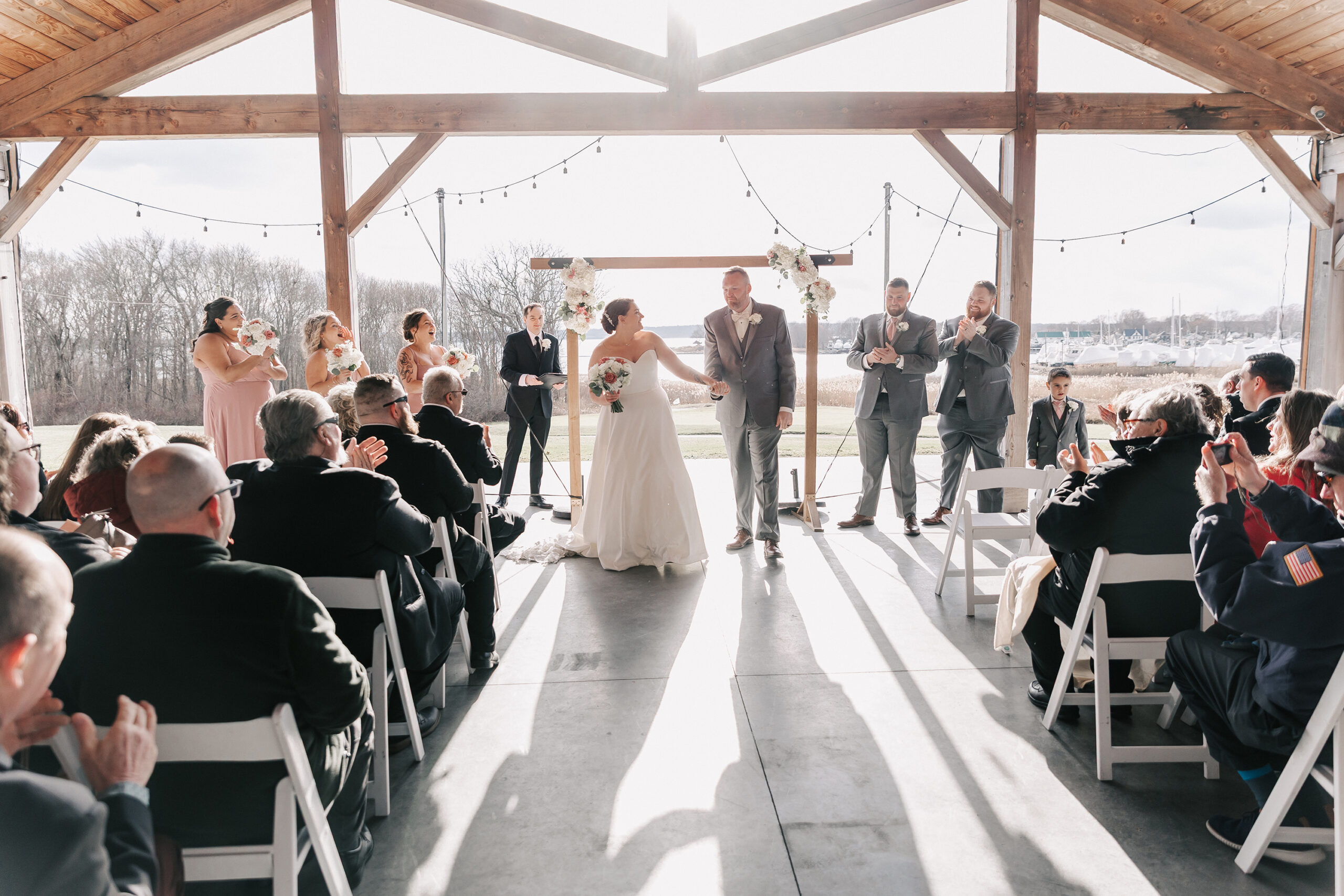 outdoor wedding ceremony at Par & Tackle bar at Harbor Lights